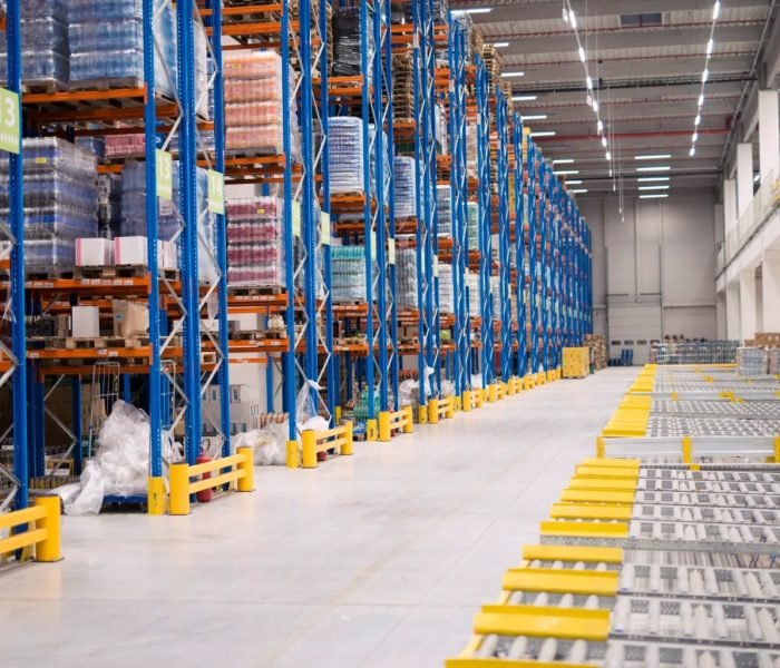 imgi_64_warehouse-storage-interior-with-shelves-loaded-with-goods-1-scaled