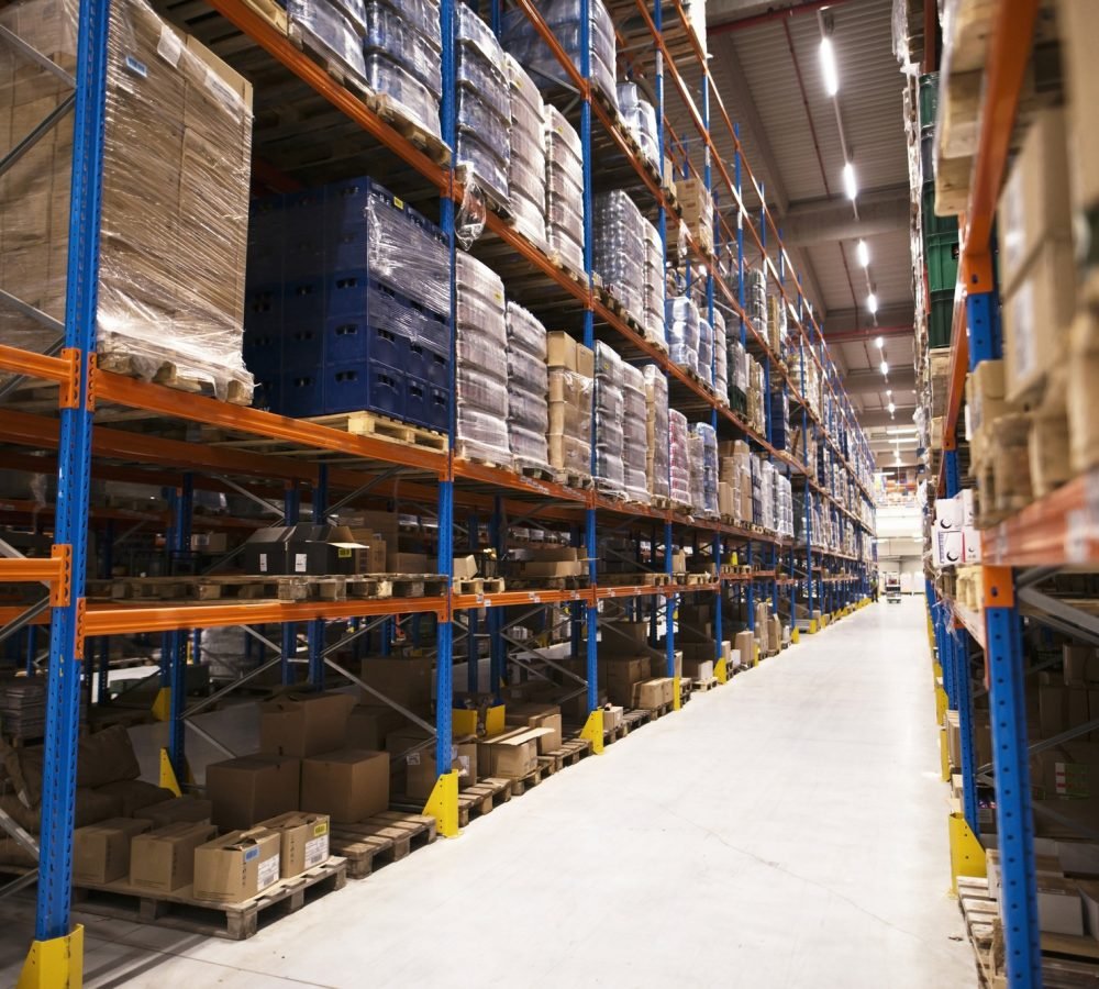 interior-large-distribution-warehouse-with-shelves-stacked-with-palettes-goods-ready-market.jpg